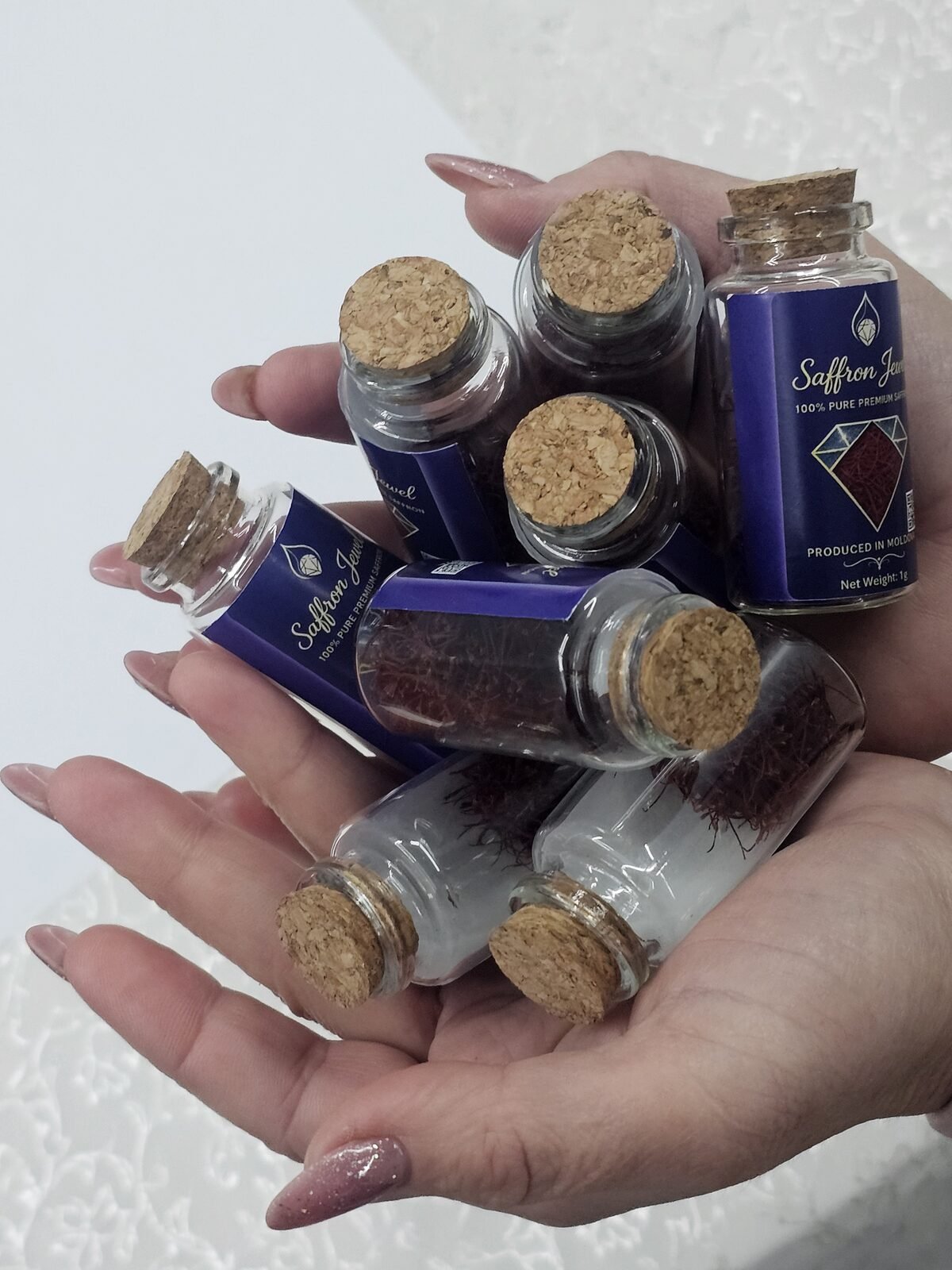 Saffron Jewel jars held in hands